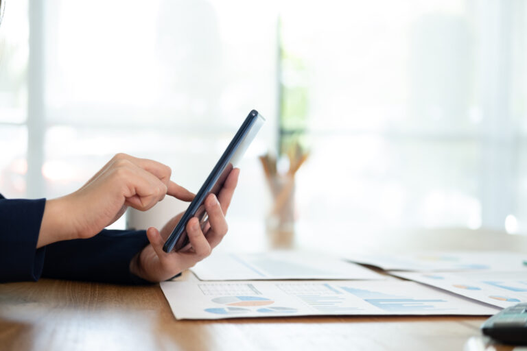 Close-up of man using mobile phone